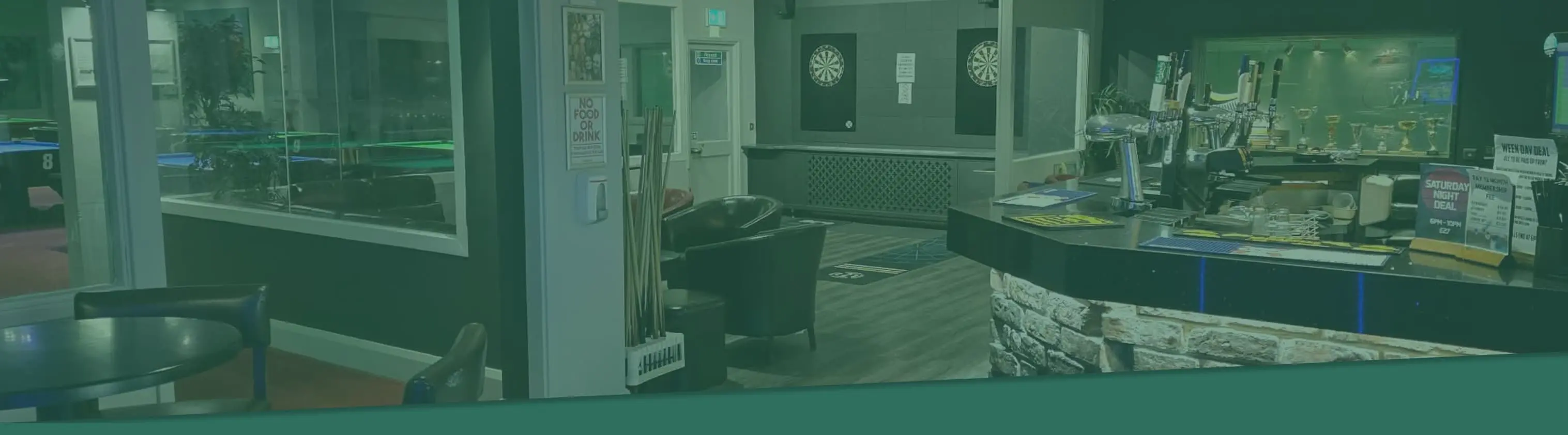 Inside 01 Club – snooker and pool tables lit in warm light